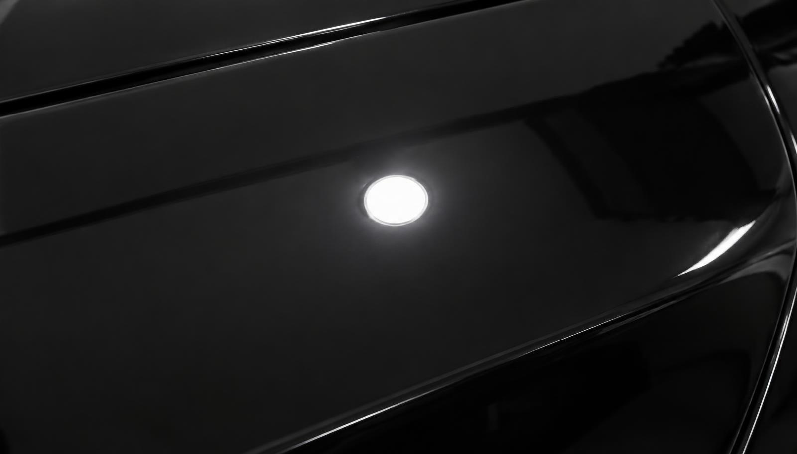 The same dark car panel defect free after three-stage paint correction in Bolingbrook, IL